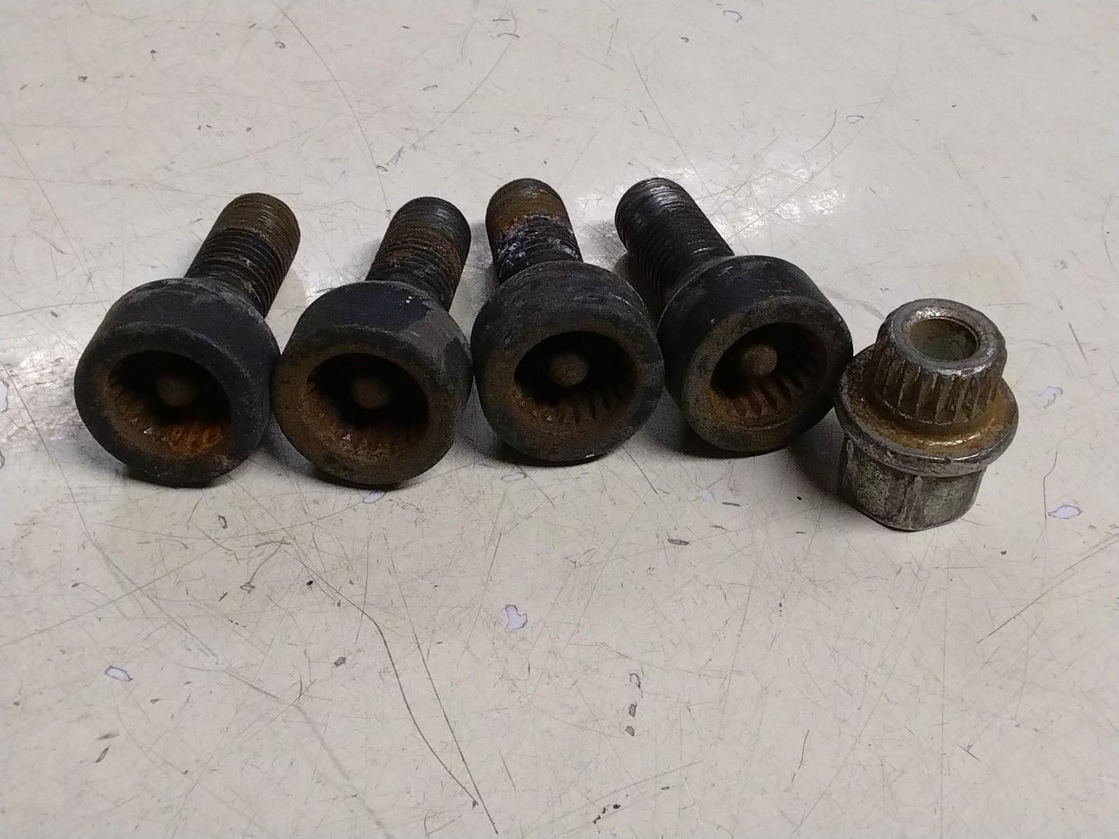 BMW E92 3 SERIES  SET OF FOUR LOCKING WHEEL NUTS AND KEY.