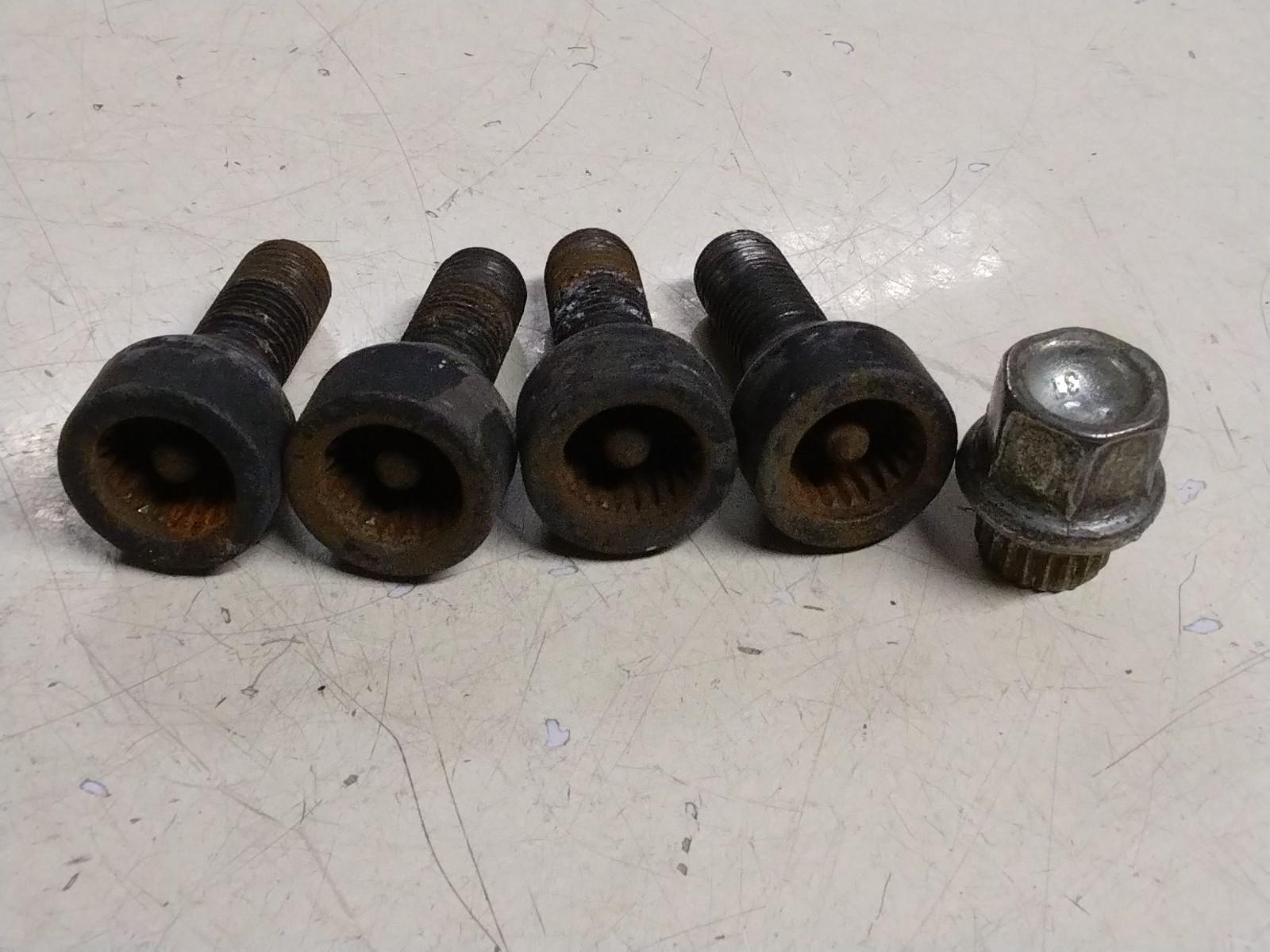 BMW E92 3 SERIES  SET OF FOUR LOCKING WHEEL NUTS AND KEY.