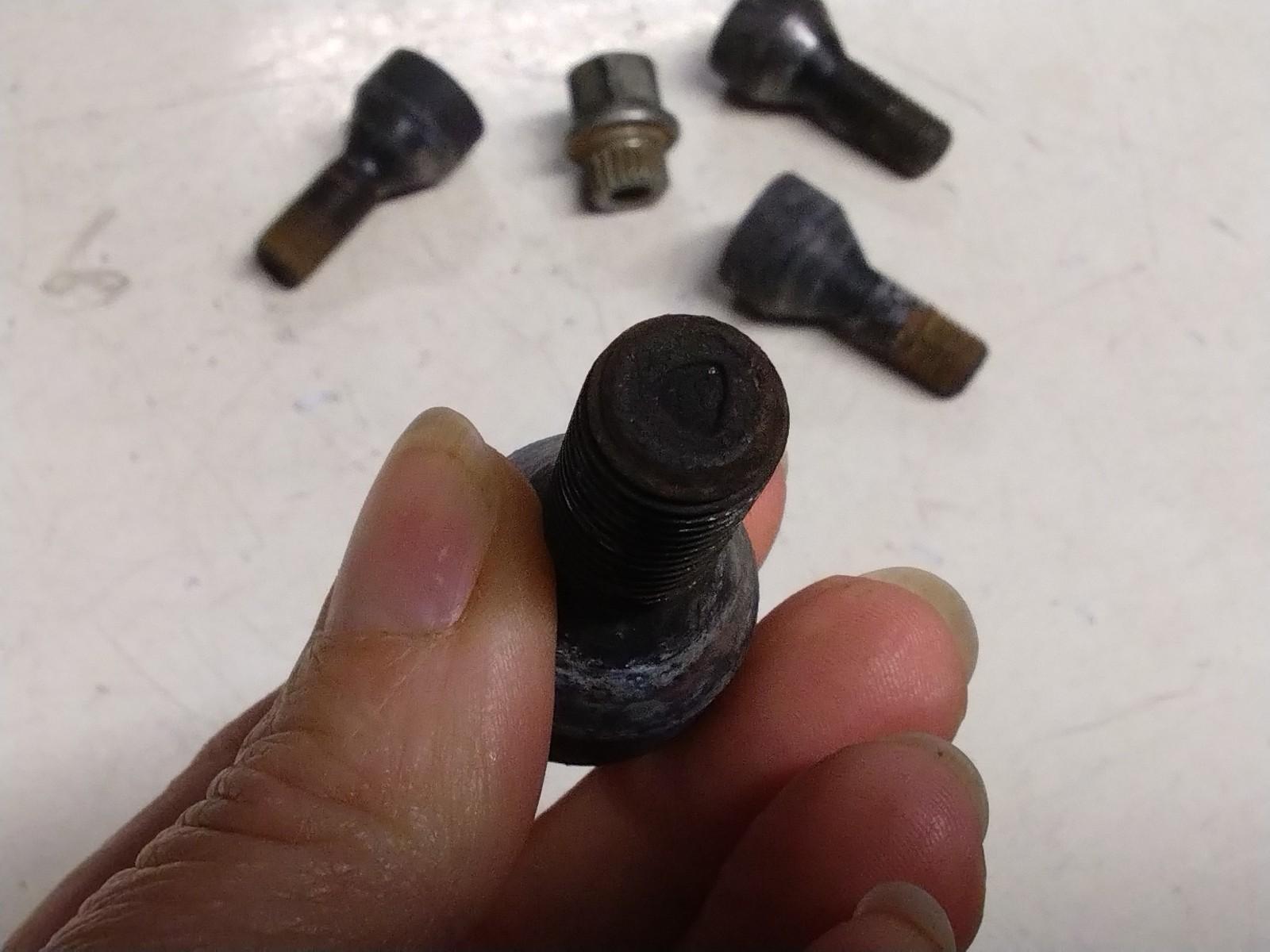 BMW E92 3 SERIES  SET OF FOUR LOCKING WHEEL NUTS AND KEY.