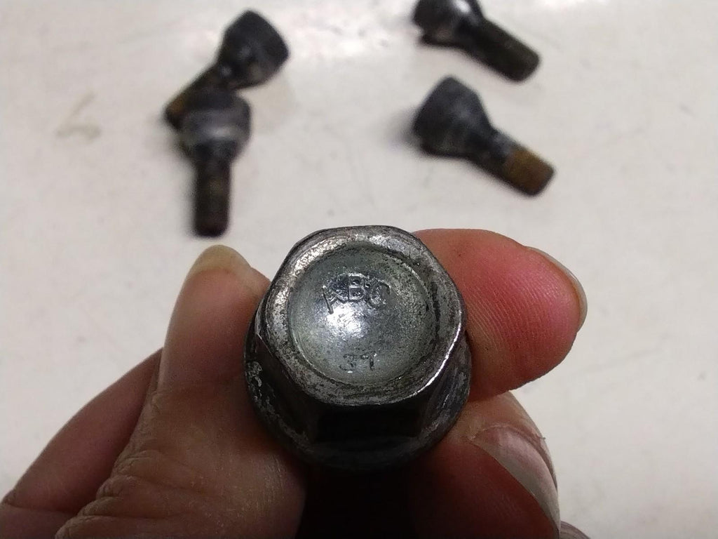 BMW E92 3 SERIES  SET OF FOUR LOCKING WHEEL NUTS AND KEY.
