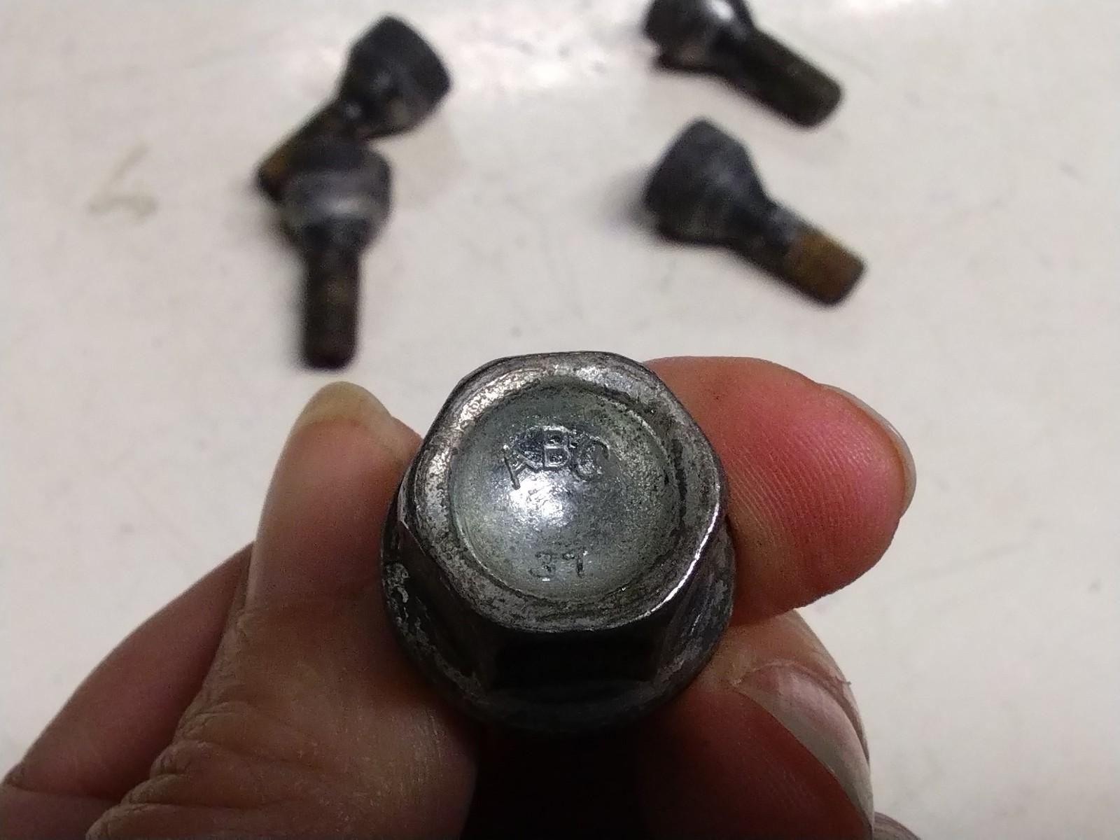BMW E92 3 SERIES  SET OF FOUR LOCKING WHEEL NUTS AND KEY.