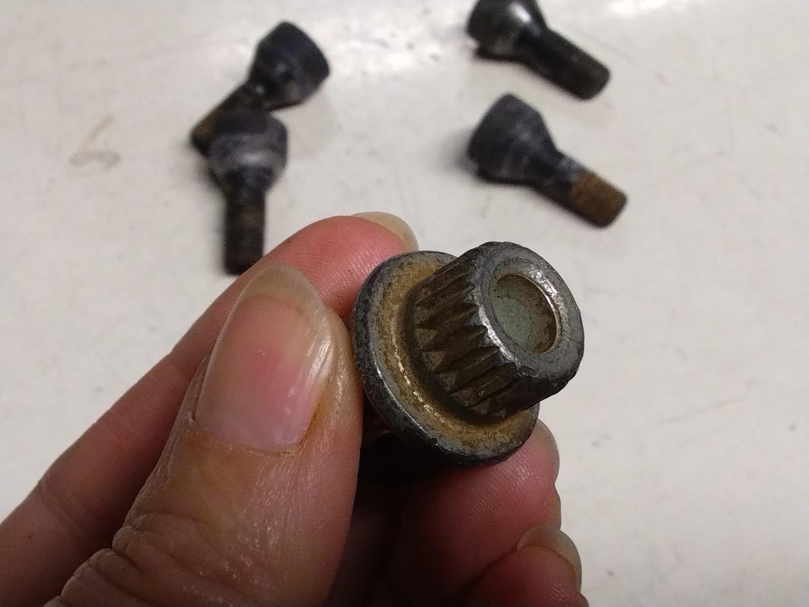 BMW E92 3 SERIES  SET OF FOUR LOCKING WHEEL NUTS AND KEY.